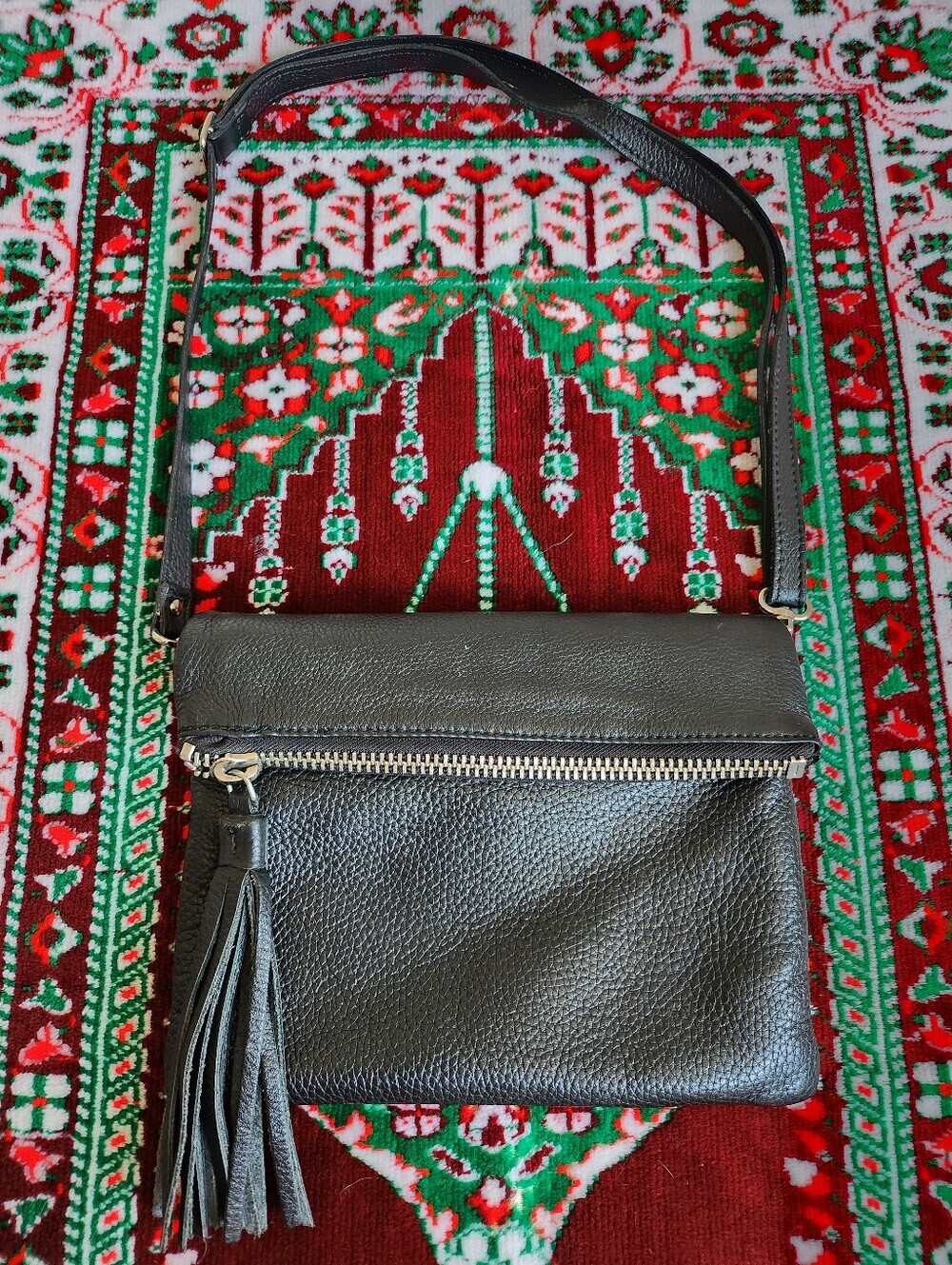 Roots Pebbled Prince Leather Foldover Crossbody With a Tassel- BLACK